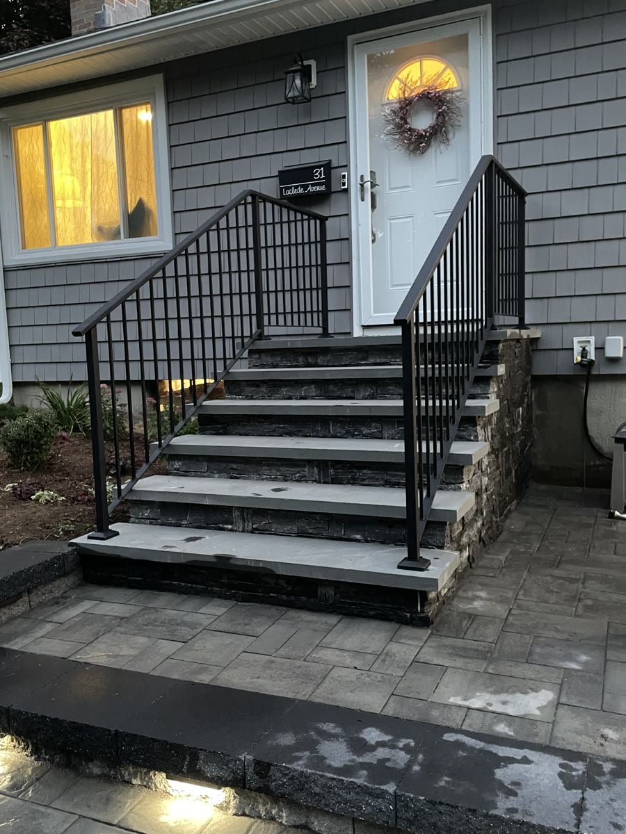 Same stone steps after custom iron railing installation by Railings of America Iron Works